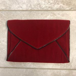 Women’s red faux velvet clutch